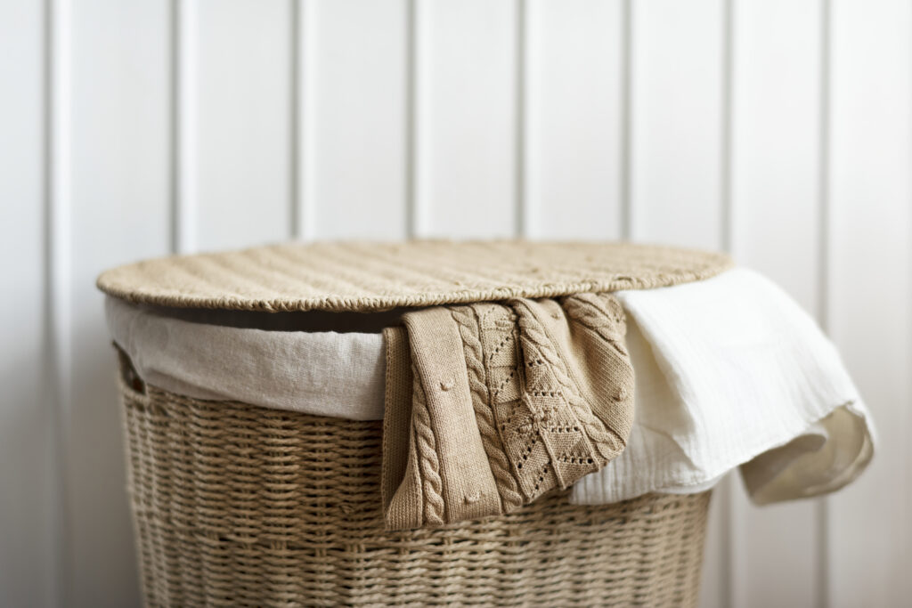 Knitted clothes in a rattan basket